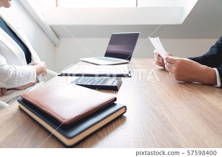 Serious man has a business meeting reading a 57598400