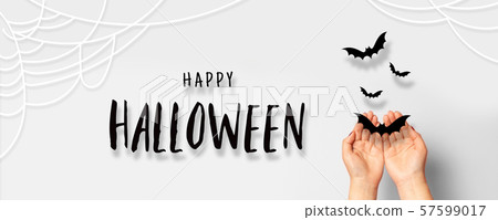 Halloween concept. Female hands with paper black Halloween concept. Female hands with paper black 57599017