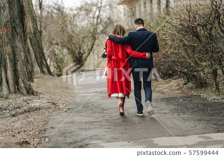 couple love go together hugs autumn landscape 57599444