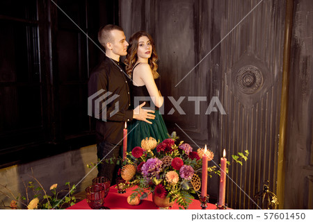 Couple with dark makeup on a white background.Loving couple. Passionate concept. Halloween concept Couple with dark makeup on a white background.Loving couple. Passionate concept. Halloween concept 57601450