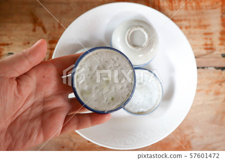 custard or coconut milk custard in small porcelain 57601472