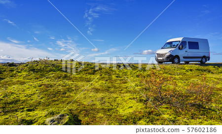 The Beautiful panorama view of blue sky and eldhraun lava field. The Green moss covered lava rock. The Beautiful panorama view of blue sky and eldhraun lava field. The Green moss covered lava rock. 57602186