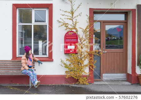 Women tourist looking the red old mailbox Women tourist looking the red old mailbox 57602276