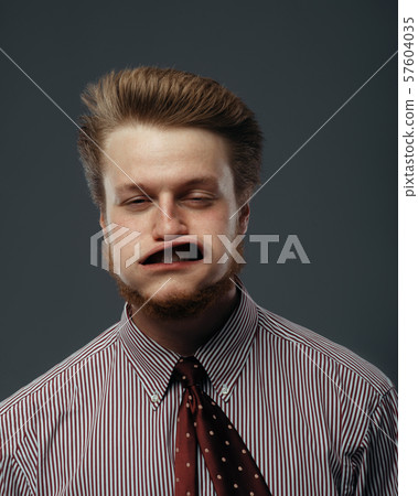 Strong wind blowing in male face, funny emotion Strong wind blowing in male face, funny emotion 57604035