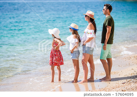 Happy beautiful family with kids on the beach 57604095