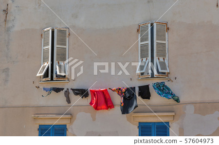 Building with washing in Ajaccio, Corsica, France. 57604973