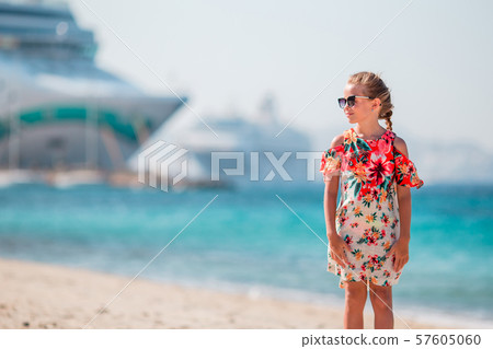 Little girl in european town outdoors on Mykonos island Little girl in european town outdoors on Mykonos island 57605060