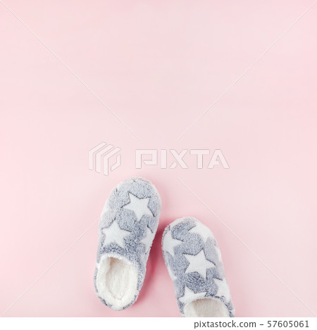 Soft fluffy slippers on pink background Soft fluffy slippers on pink background 57605061