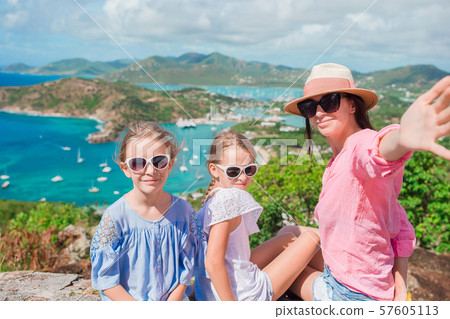Mother and kids taking selfie with view of English Harbor from Shirley Heights, Antigua, paradise Mother and kids taking selfie with view of English Harbor from Shirley Heights, Antigua, paradise 57605113