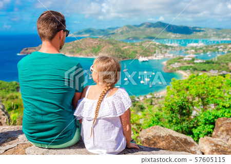 Family enjoying the view of picturesque English Harbour at Antigua in caribbean sea Family enjoying the view of picturesque English Harbour at Antigua in caribbean sea 57605115
