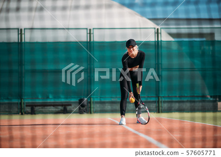 Young beautiful woman playing tennis on court. Healthy sport lifestyle 57605771