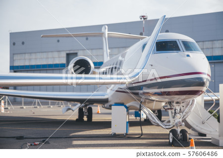 modern and comfortable business jet plane in the afternoon at the airport 57606486
