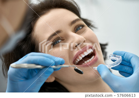 Pretty woman's teeth treatment in dental clinic Pretty woman's teeth treatment in dental clinic 57606613