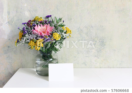Glass vase with beautiful colorful bouquet of dahlia, tansies and aster flowers. Grunge old wall 57606668