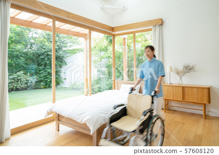 Caregiver care facility wheelchair hospital room medical image Caregiver care facility wheelchair hospital room medical image 57608120