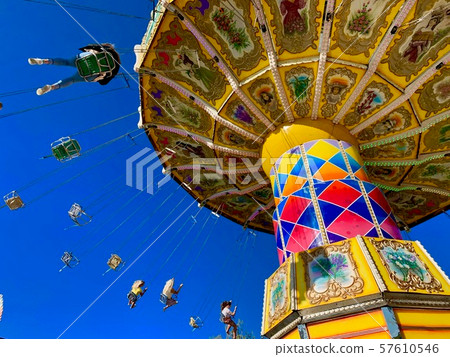 A cloudless sunny amusement park A cloudless sunny amusement park 57610546