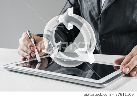 Female hands using graphics tablet and glass icons fly in air. Mixed media 57611109