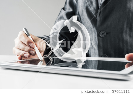 Female hands using graphics tablet and glass icons fly in air. Mixed media 57611111