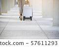 Business woman Dragging suitcase luggage 57611293
