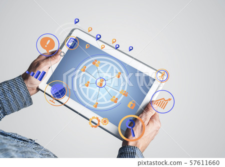 Hands of businessman holding tablet pc with social connection concept Hands of businessman holding tablet pc with social connection concept 57611660