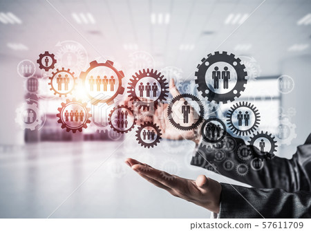 Cogwheels and gears mechanism as social communication concept 57611709
