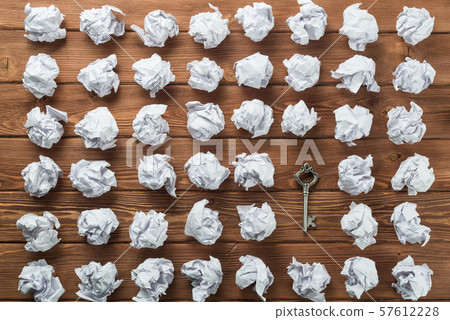 Concept of success and opportunity with old key among paperballs Concept of success and opportunity with old key among paperballs 57612228
