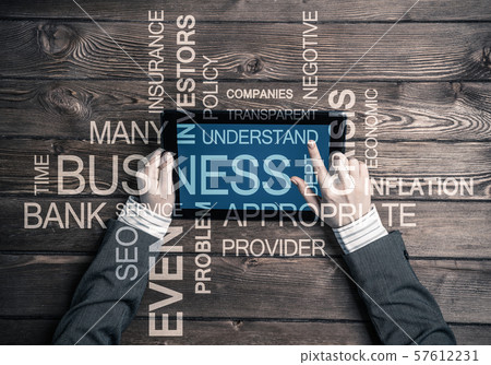 Hands of businesswoman using tablet pc and business conceptual words Hands of businesswoman using tablet pc and business conceptual words 57612231