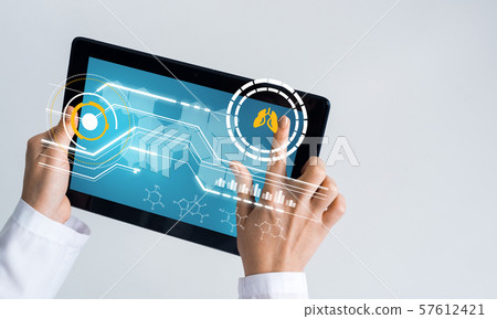 Close of female doctor hands working with tablet pc computer Close of female doctor hands working with tablet pc computer 57612421