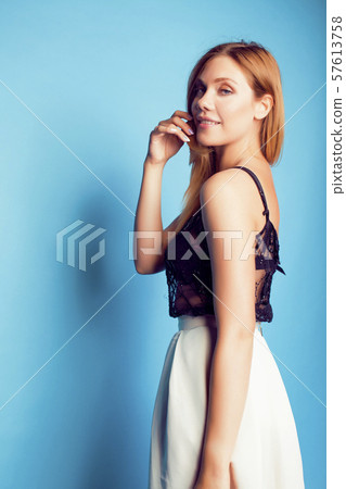 young pretty modern girl posing emotional happy on blue background, lifestyle people concept young pretty modern girl posing emotional happy on blue background, lifestyle people concept 57613758