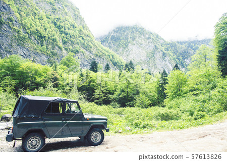 jeep on road hight in mountain, beautiful summer landscape with river jeep on road hight in mountain, beautiful summer landscape with river 57613826