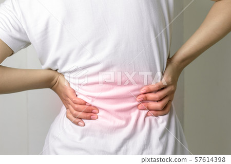 Young female with backache. Young female with backache. 57614398