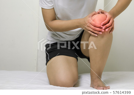 Woman having knee pain Woman having knee pain 57614399