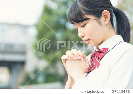 Praying high school girl Praying high school girl 57615476