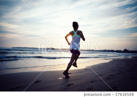 young healthy lifestyle woman running at sunrise 57616589