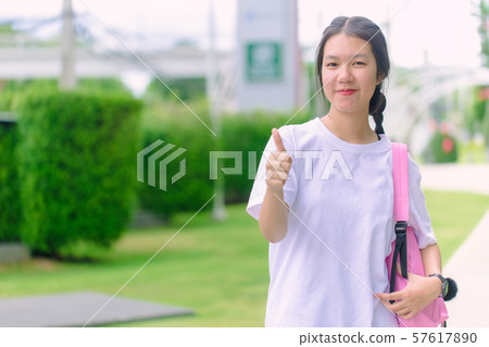 Asian young girl teen smiling with thumb up 57617890