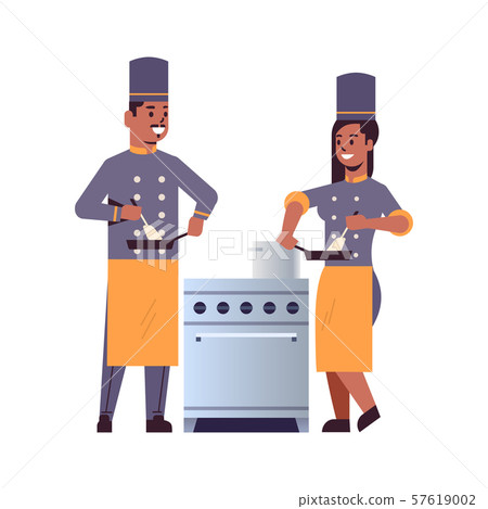 cooks couple professional chefs using frying pan stirring food african american man woman restaurant 57619002