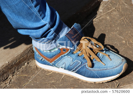 sneakers from jean fabric standing on ground sneakers from jean fabric standing on ground 57620600
