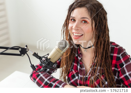 Music, dj and people concept - young woman working at the radio 57621718
