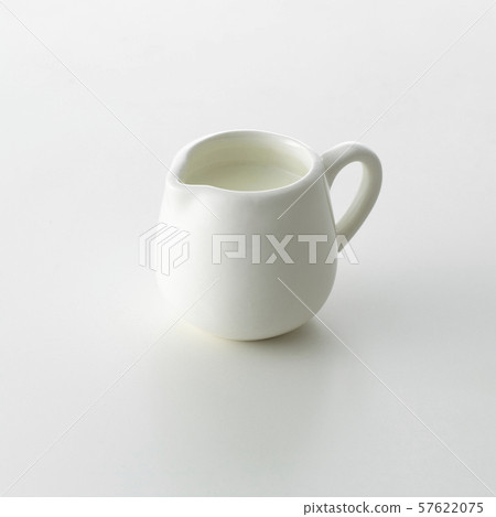 Milk pot on white background 57622075
