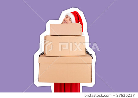 Happy woman in chistmas hat hugs a gift Happy woman in chistmas hat hugs a gift 57626237