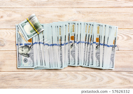 Close up of 100 dollar bills in a row on colorful Close up of 100 dollar bills in a row on colorful 57626332