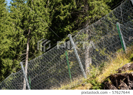 Rockfall barrier with wire mesh - Trentino Alto Adige Italy Rockfall barrier with wire mesh - Trentino Alto Adige Italy 57627644