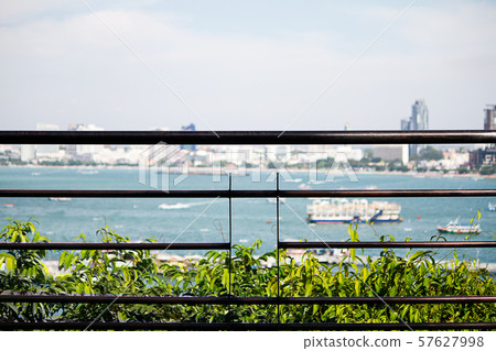 Metal balcony on blurred beach background 57627998