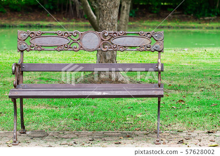 Old vintage grunge rusty iron and wooden bench in 57628002