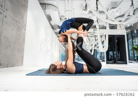Young adult mother doing fitness with her little daughter Young adult mother doing fitness with her little daughter 57628162