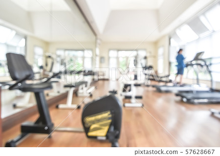 Blur gym background fitness center or health club with blurry sports exercise equipment for aerobic workout and bodybuilding 57628667