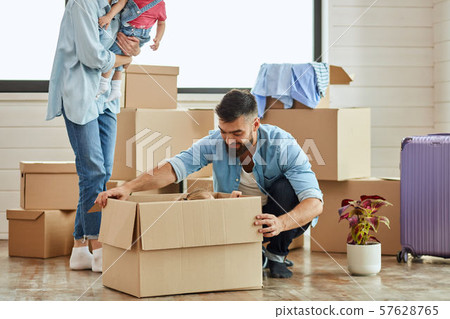 Caucasian family move in new house Caucasian family move in new house 57628765