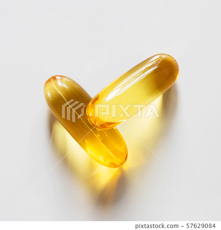 Supplement omega 3 fish oil capsules on white background 57629084