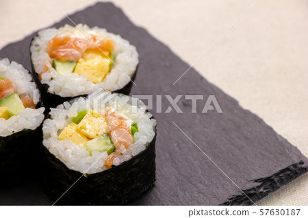 Salmon salad roll (on slate plate). 57630187