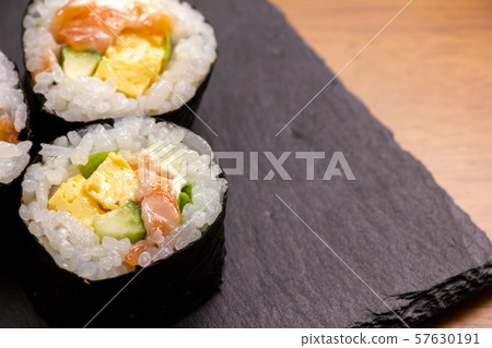 Salmon salad roll (on slate plate). 57630191